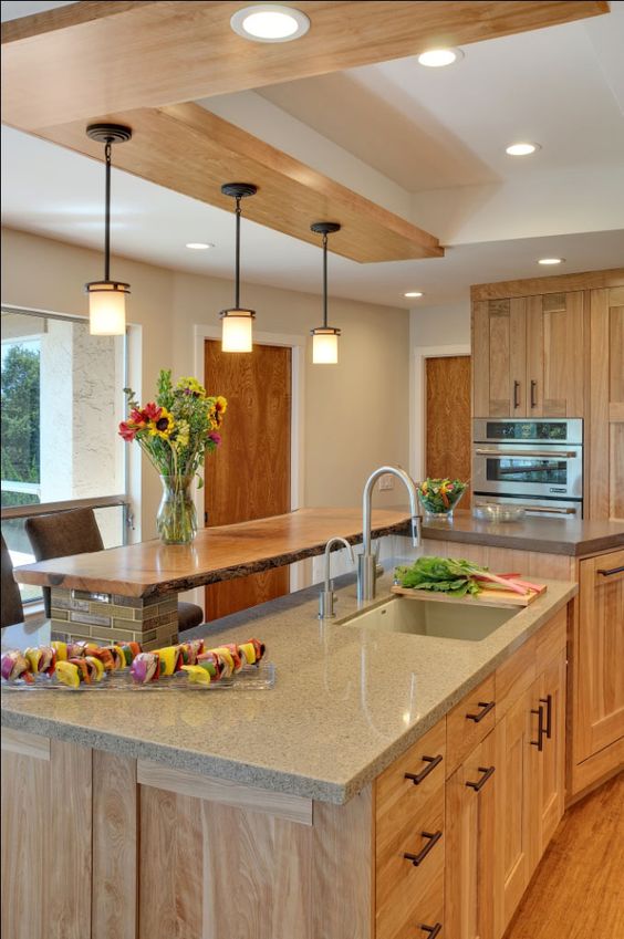 red birch cabinets with grey quartz countertops