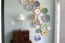 31 make a wall art of decorative plates that you’ve brought from various countries