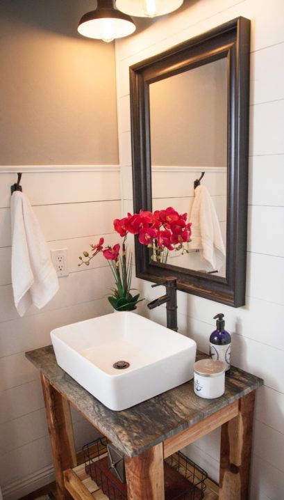 small rough farmhouse bathroom vanity with an open shelf