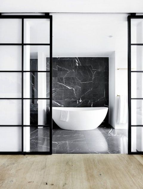 black framed sliding glass doors for a bathroom