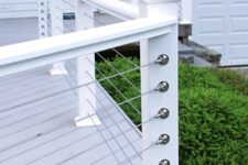 38 simple white posts and horizontal cable railing for a beachside cottage