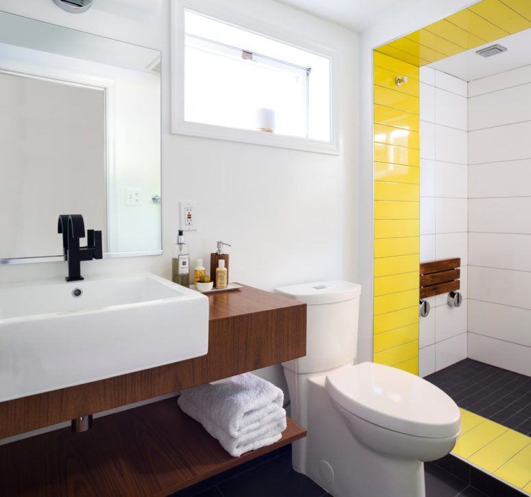 Mixing a white sink and a wooden vanity works for any bathroom style. (Case Design/Remodeling, Inc.)