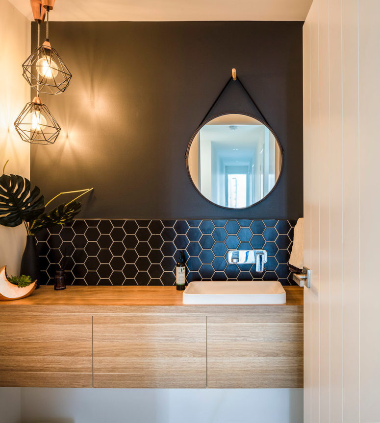Faux oak floating vanity fits well modern and industrial bathrooms. (DAYNE LAWRIE constructions)