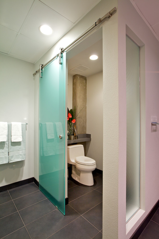 a sliding frosted glass barn door works well for a powder room (Yearley Interiors)