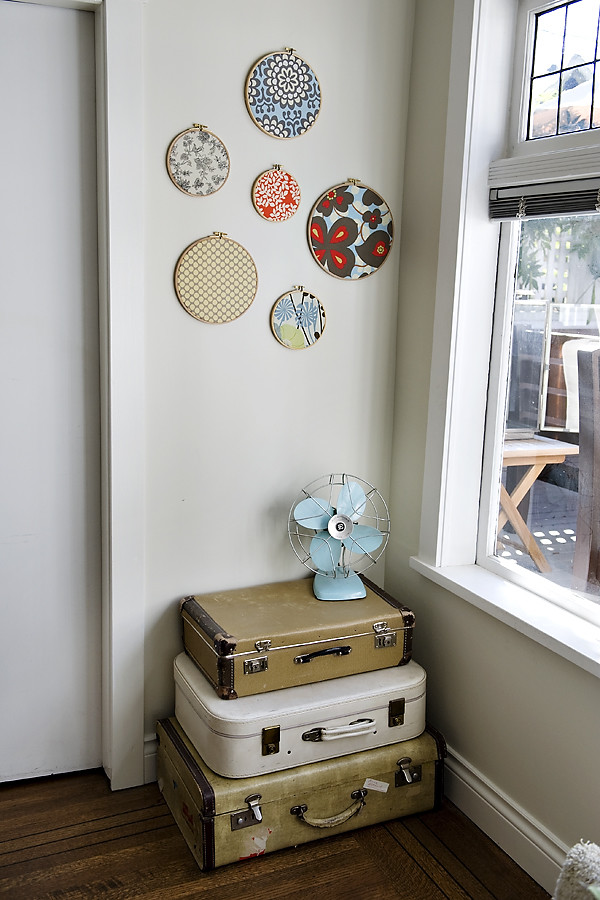 a stack of old suitcases fit nice into an awkward corner and even acts as a console table