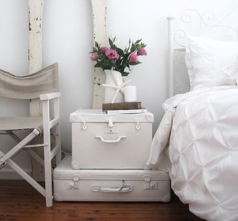 painted vintage suitcases could be used as a bedside table in a beach-inspired bedroom (sususu)