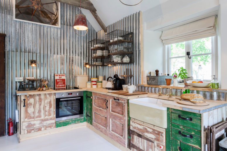 corrugated metal walls looks amazing with distressed cabinets and repurposed furniture (Chris Snook)