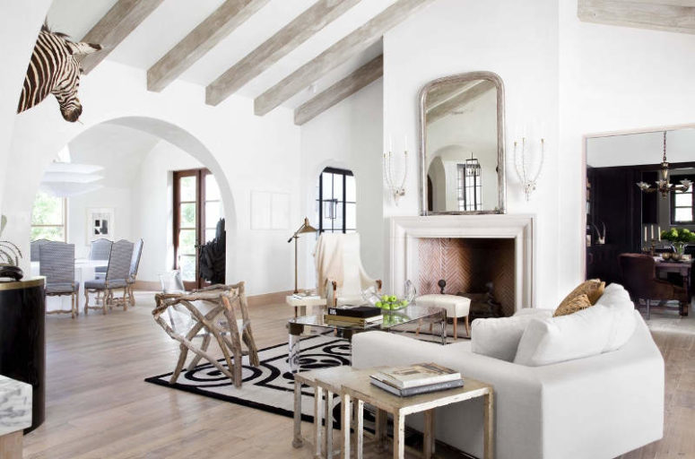 interior with open layout The space has an open layout, there's much white including furniture, wooden beams echo with floor covers