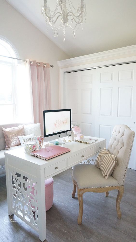 a girlish desk in white with laset cut legs creates a mood in this room