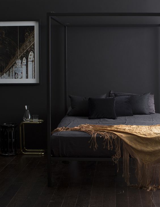 black metal frame bed with posts is ideal for a guy's bedroom