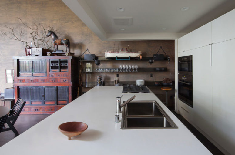 open space The lower level has an open layout, which unites the kitchen, dining and living spaces in one