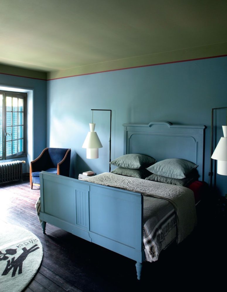 blue bedroom design The master bedroom is done in blue shades, it features cool architectural lamps and a cobalt blue chair