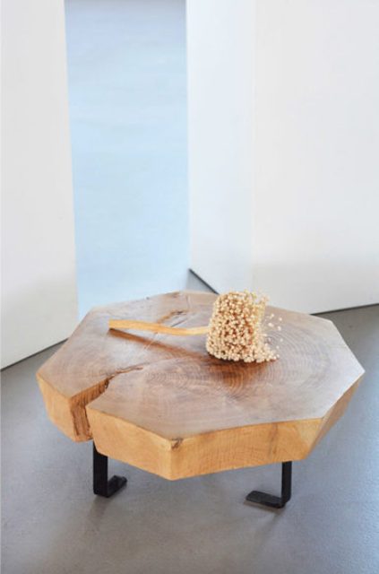 industrial coffee table This item has an industrial feel, too, due to the bent black metal legs, love the natural crack on the top