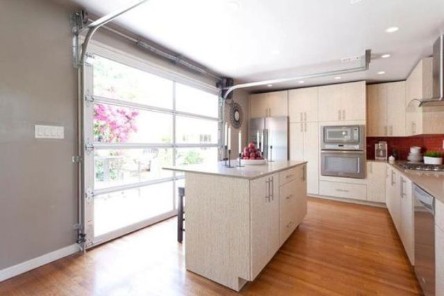 install a glass garage door for a bright, open air kitchen