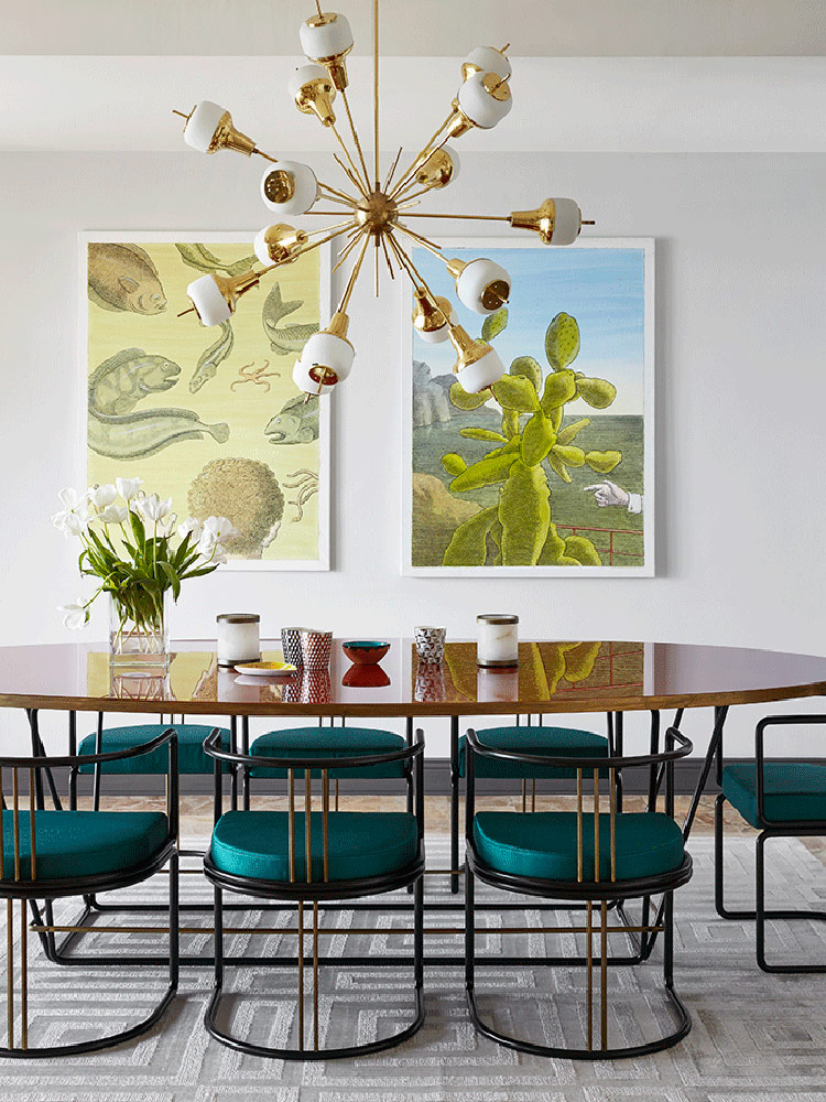 Emerald chairs and a mid century modern chandelier create a style in the dining space, and artworks create a mood Emerald chairs and a mid-century modern chandelier create a style in the dining space, and artworks create a mood