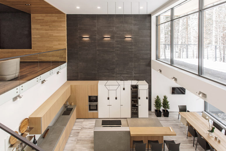 The social area is contained on the lower level and encompasses the kitchen, dining and living spaces The social area is contained on the lower level and encompasses the kitchen, dining and living spaces