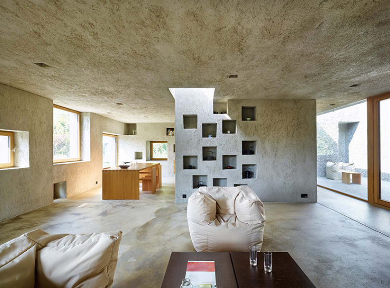 concrete home decor Concrete also dominates the interiors, it covers walls, floors and ceilings, and light-colored wood makes them cozier