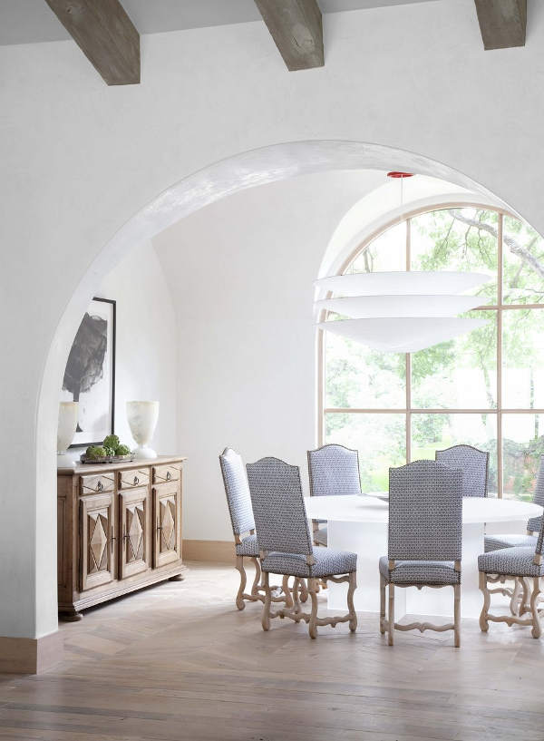 The dining space is by the window, so it's filled with light, and I love blue upholstered chairs very much