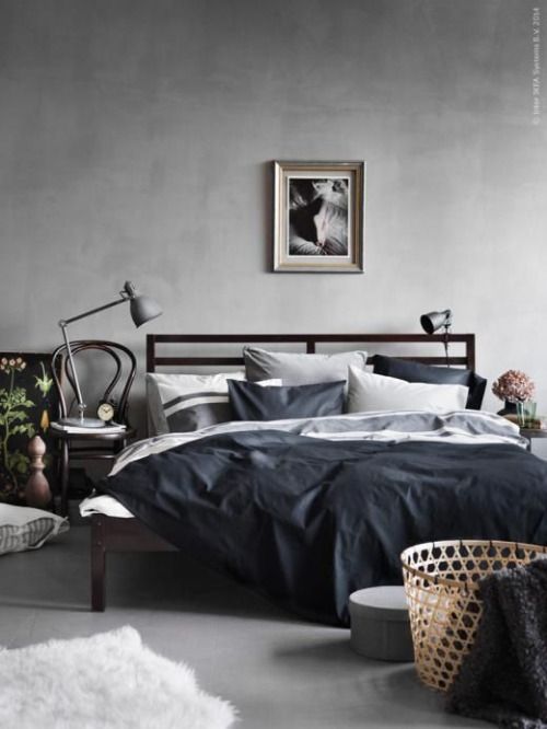 dark wood frfame bed for a modern masculine bedroom