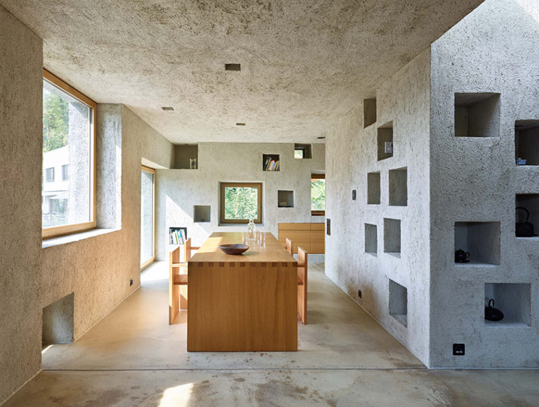 concrete in wall storage Concrete openings are used for storage inside the house, and lots of windows bring much light in