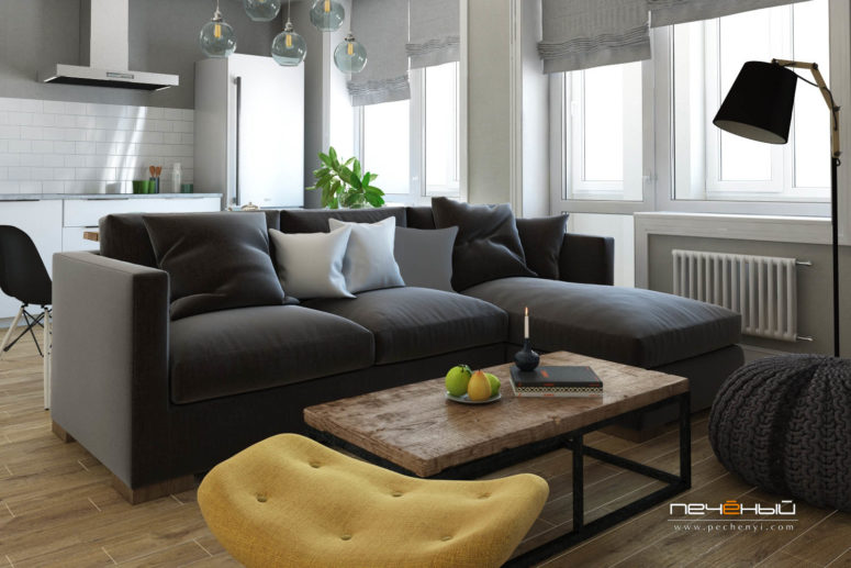 I love the rustic wood coffee table, a knitted pouf, a sunny yellow chair for a bold touch, and a graphite grey sofa works as a space divider I love the rustic wood coffee table, a knitted pouf, a sunny yellow chair for a bold touch, and a graphite grey sofa works as a space divider