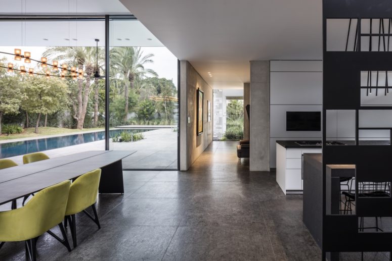 Metal, glass and polished concrete plus cozy upholstery made the decor more textural and eye catching Metal, glass and polished concrete plus cozy upholstery made the decor more textural and eye-catching