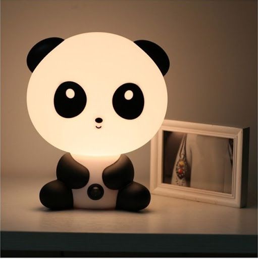 a panda table lamp - press its belly button and this charming lamp will lighten up the room with a soft glow