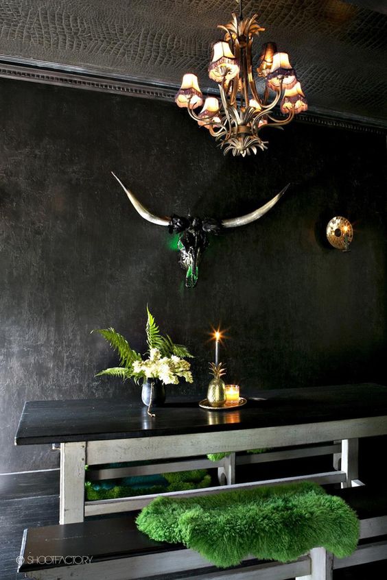 wooden whitewashed dining table with a black top