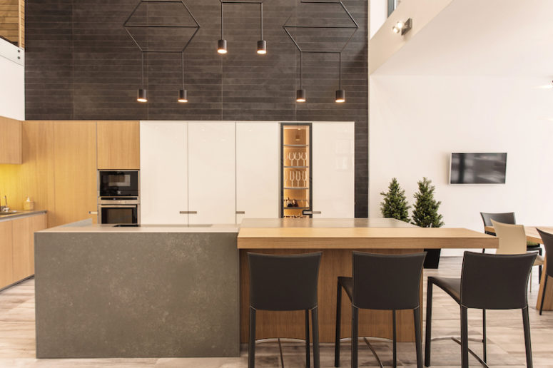 Modern Wood Wrapped Residence With Adorable Views Digsdigs The Kitchen Island Is Simple And Robust Features A Wooden Bar Extension