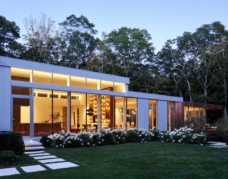 Extensive glazings connect outdoors and indoors, and I love white blooms