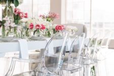 08 acrylic dining chairs and an animal print rug for a glam dining space