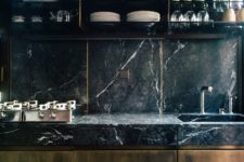 08 brown kitchen cabinets with black marble countertops and a backsplash