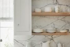 08 stone slab counters and light-colored wooden shelves for a modern fresh look