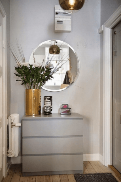 The entryway is small, with metallic accents