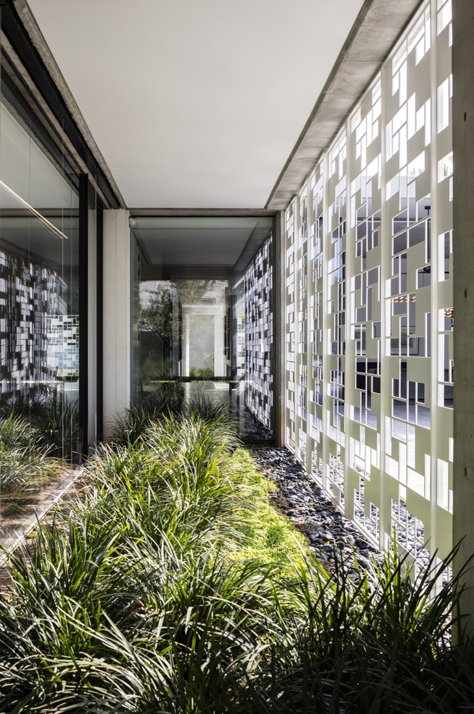 geometric interior design idea White geometric screens let enough light in, though keep privacy and don't let the spaces overheat