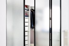 10 The closet is separated with foldable frosted glass doors that save the space