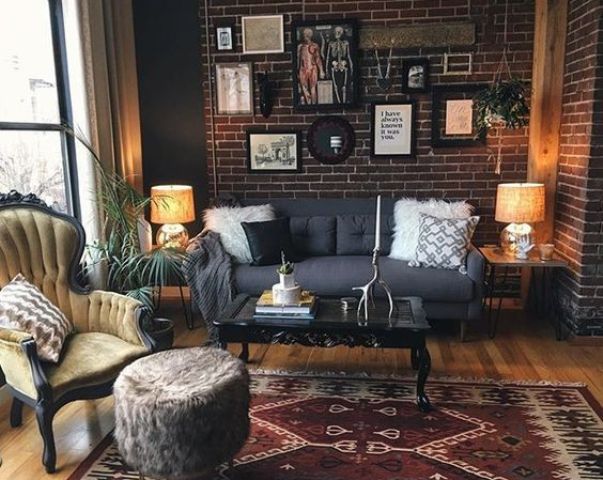 a dark grey upholstered sofa and a yellow upholstered chair for a colorful statement