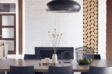 11 a simple wooden table is highlighted with chic modern chairs in black color and an echoing lamp