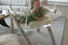 11 modern acrylic chair on rough wooden legs and with armrests