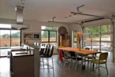 11 open plan kitchen and dining space with sectioned glass garage doors