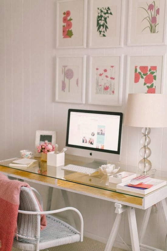 a white desk with gold lining and a glass top