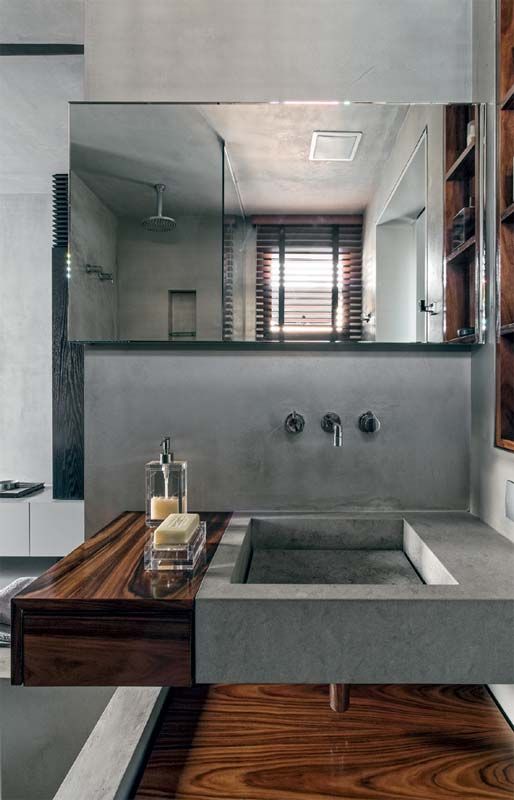 a concrete sink and a wooden sink holder look chic and textural