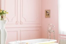14 a fun sunny yellow clawfoot bathtub in a pink bathroom