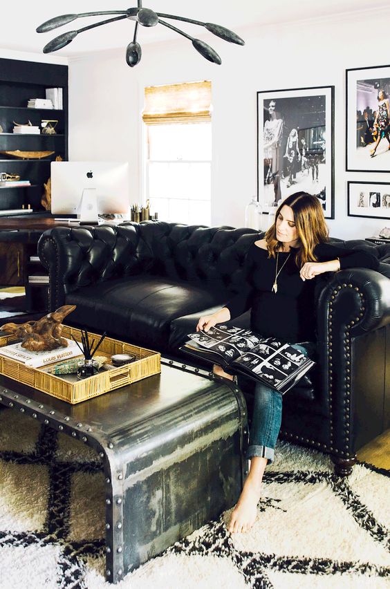 a gorgeous polished metal coffee table with nails