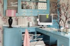 14 blue cabinets and a desk create a united system and look very cute
