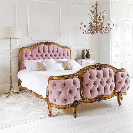 luxury pink tufted bed with gilded wood framing looks wow