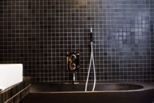 15 a dark matte bathtub is perfect for any modern masculine bathroom