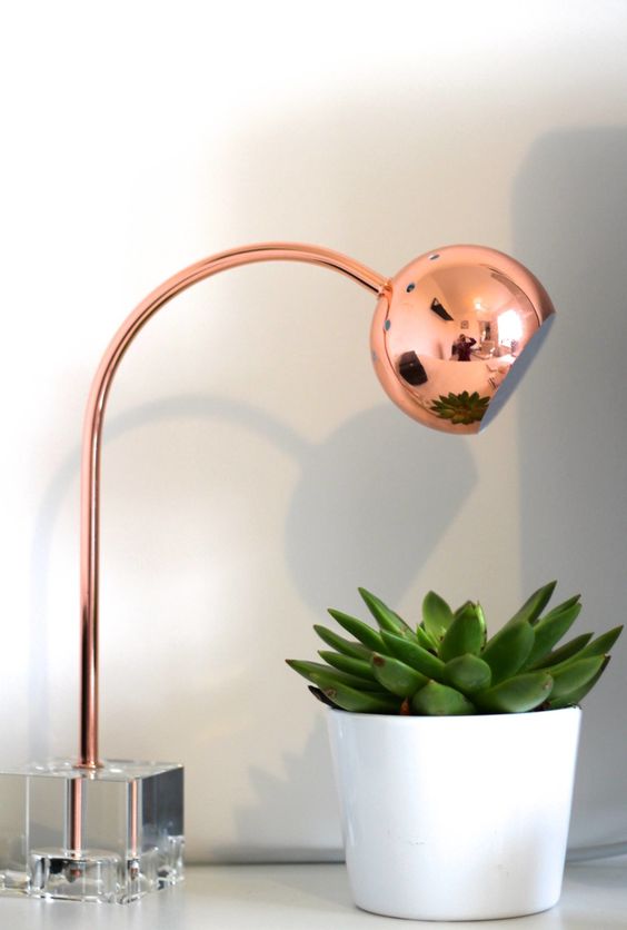 modern copper round lamp with a glass base