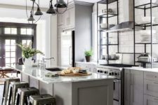 16 a grey kitchen island with a white marble countertop and industrial stools