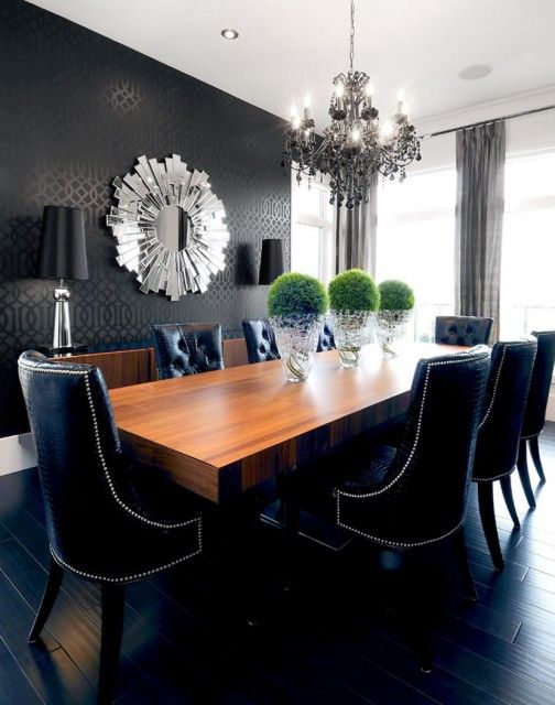 black leather tufted dining chairs with nailhead trim are the most eye-catching here